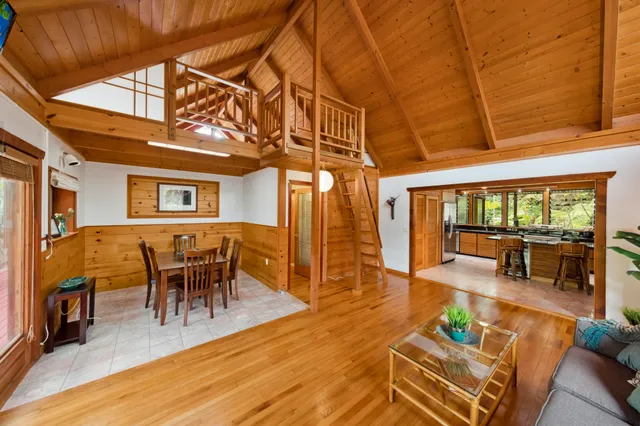 a view of living room filled with furniture and wooden floor