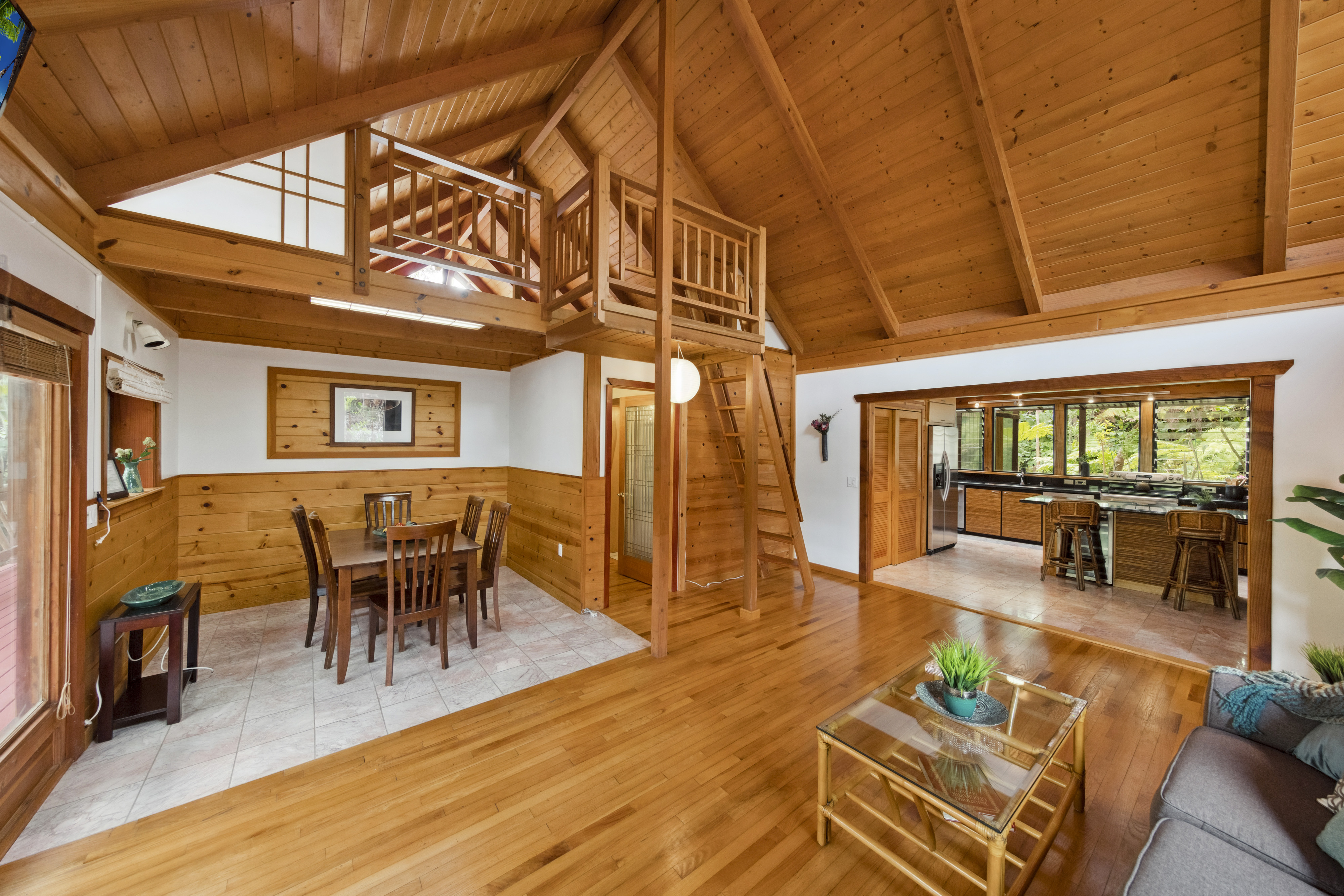 19-4245 Kekoa Nui Boulevard Volcano, HI 96785 - Photo 9 of 30 a view of a dining room with furniture window and wooden floor