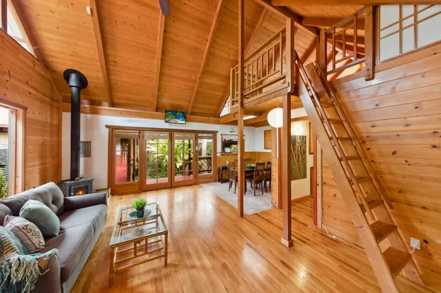 a view of a chairs and table in the balcony