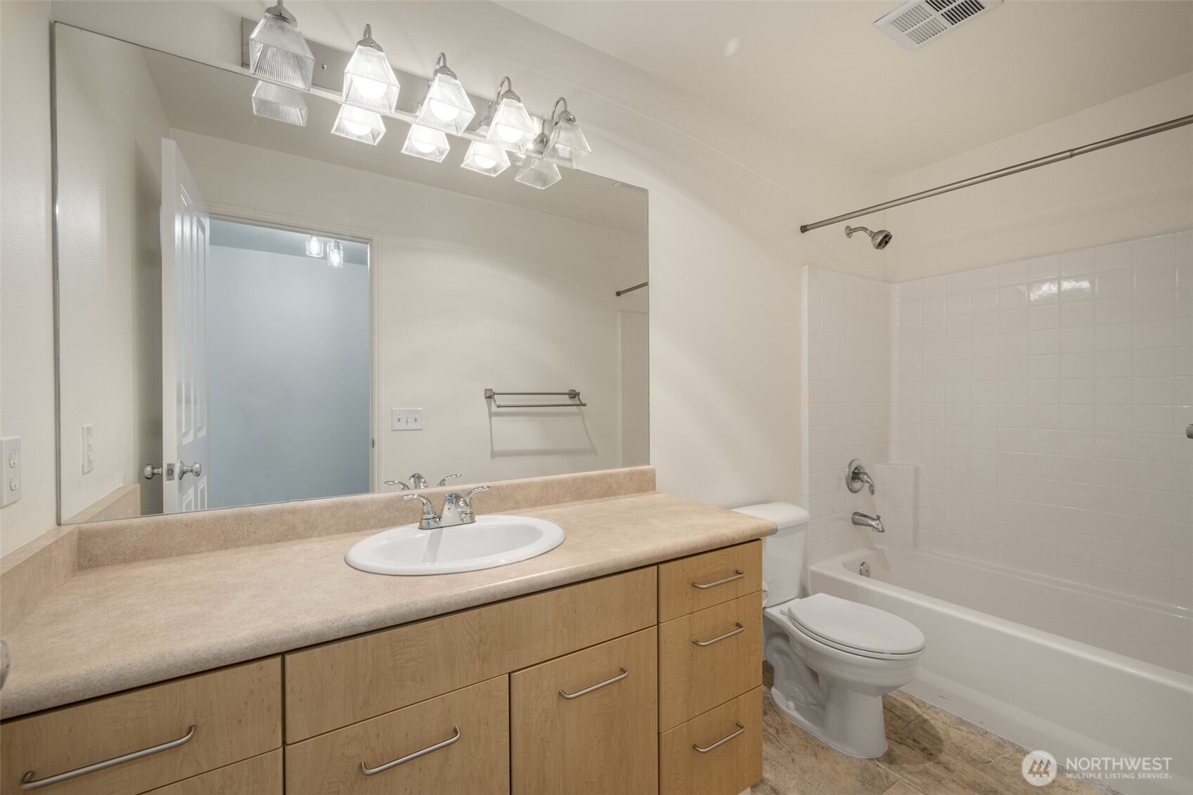 710 240th Way Southeast, Unit J302 Sammamish, WA 98074 - Photo 16 of 22 a bathroom with a granite countertop sink a toilet and shower
