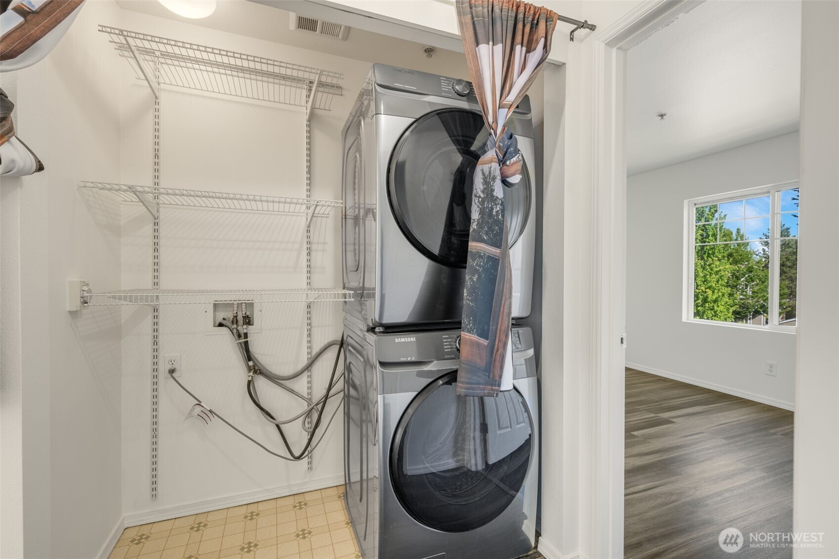 710 240th Way Southeast, Unit J302 Sammamish, WA 98074 - Photo 17 of 22 a close view of utility room with washer and dryer