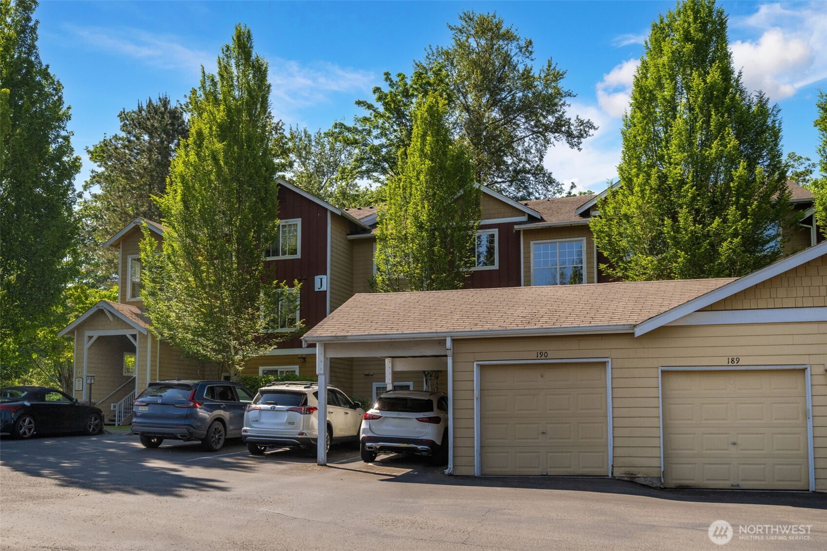 710 240th Way Southeast, Unit J302 Sammamish, WA 98074 - Photo 20 of 22 a view of a car park in front of house