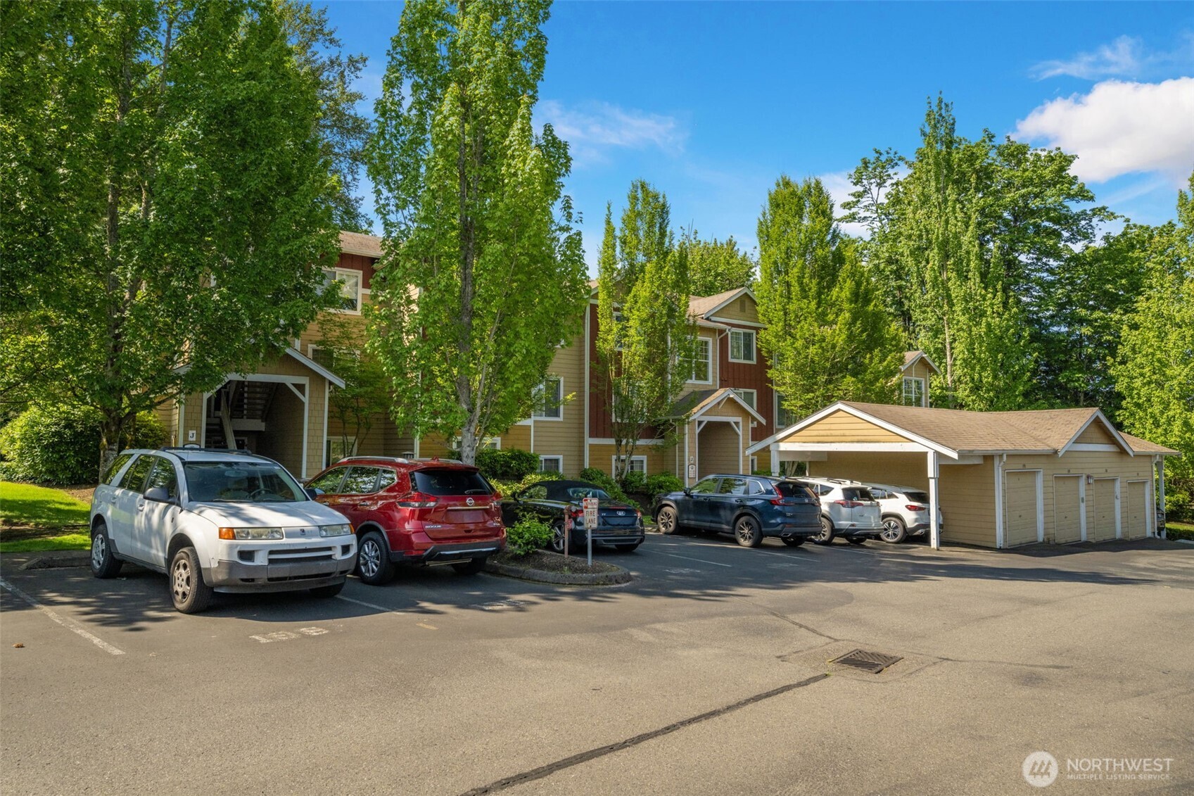 710 240th Way Southeast, Unit J302 Sammamish, WA 98074 - Photo 21 of 22 a car parked in front of a house