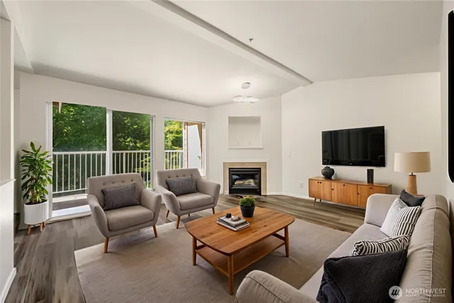 a living room with furniture fireplace and a flat screen tv
