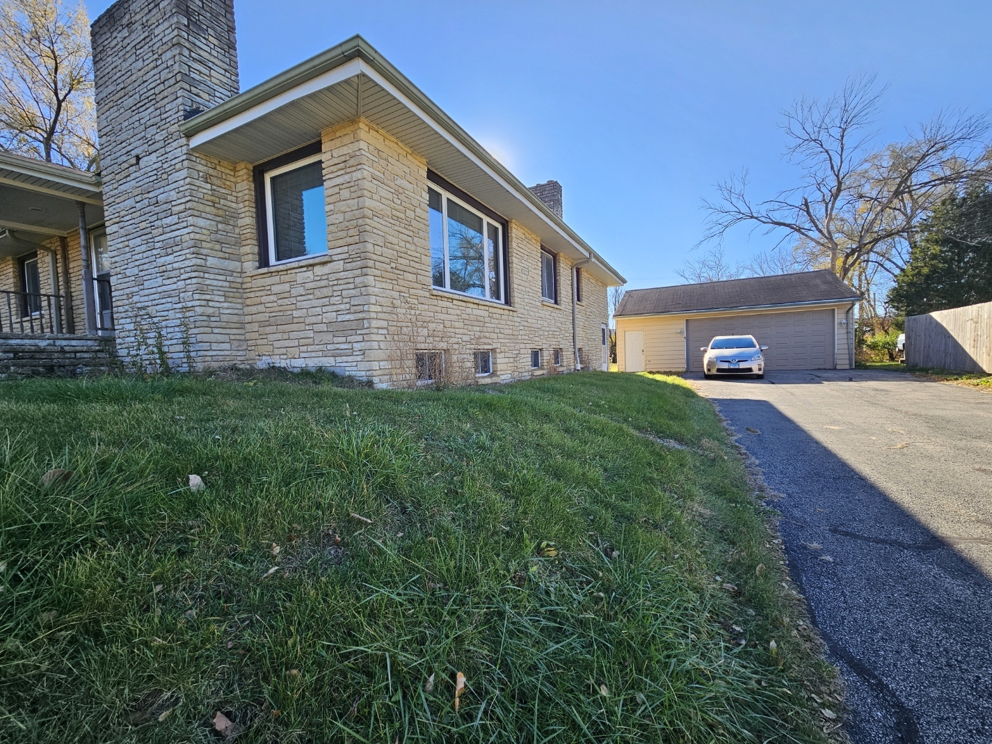 811 Hoyle Road Lombard, IL 60148 - Photo 22 of 22 a front view of a house with a yard and garage