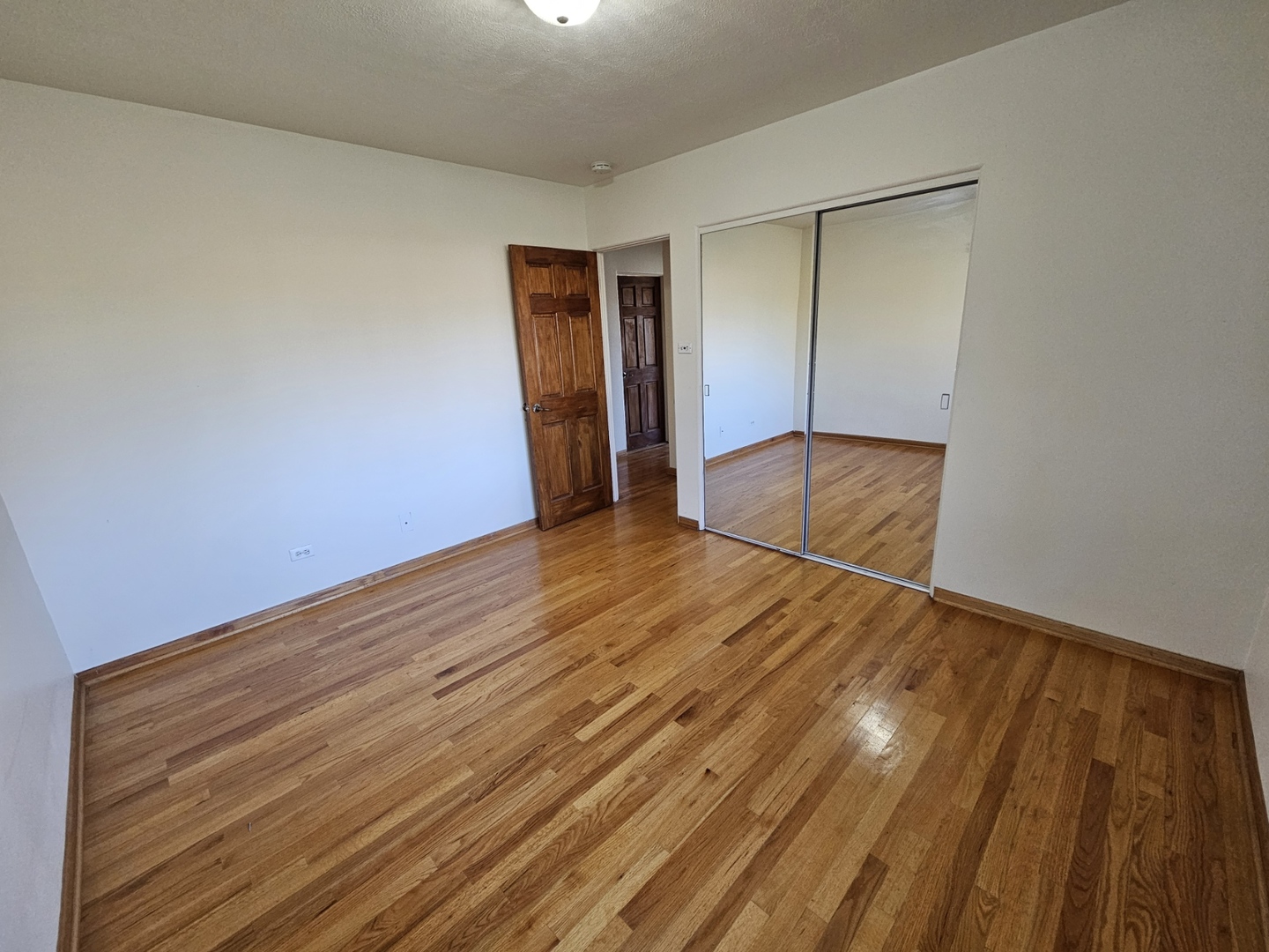 811 Hoyle Road Lombard, IL 60148 - Photo 6 of 22 a view of empty room with wooden floor