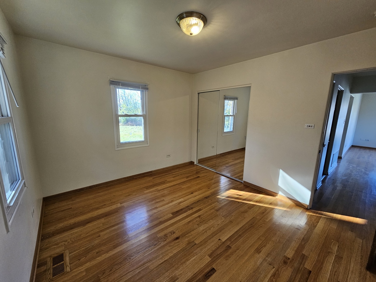 811 Hoyle Road Lombard, IL 60148 - Photo 8 of 22 a view of empty room with wooden floor and fan