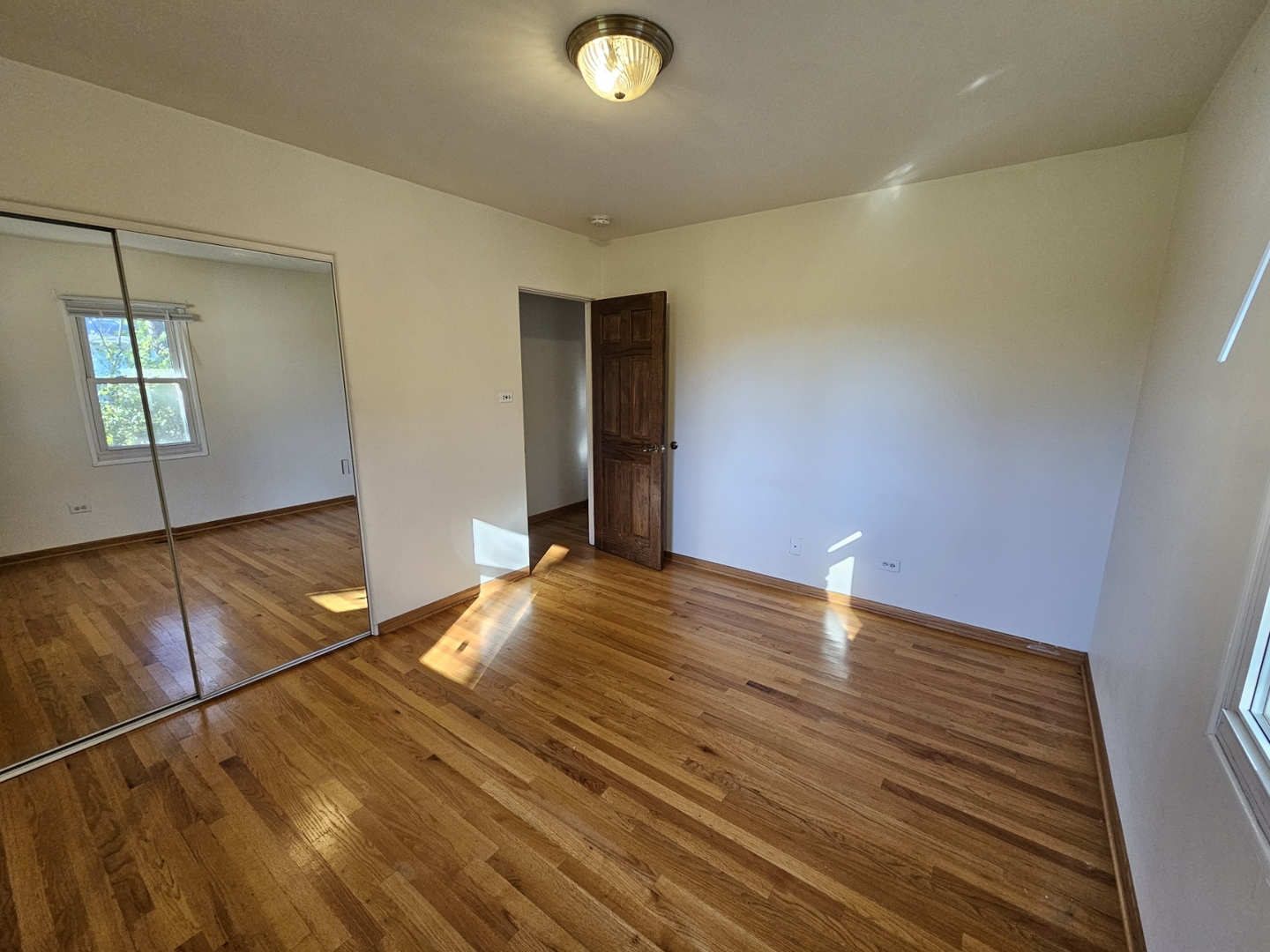 811 Hoyle Road Lombard, IL 60148 - Photo 9 of 22 a view of empty room with wooden floor