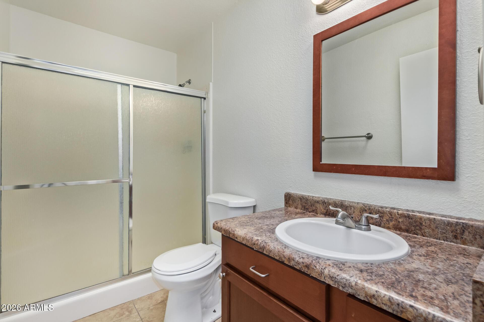 3929 South Pine Street Tempe, AZ 85282 - Photo 11 of 23 a bathroom with a granite countertop sink toilet and shower