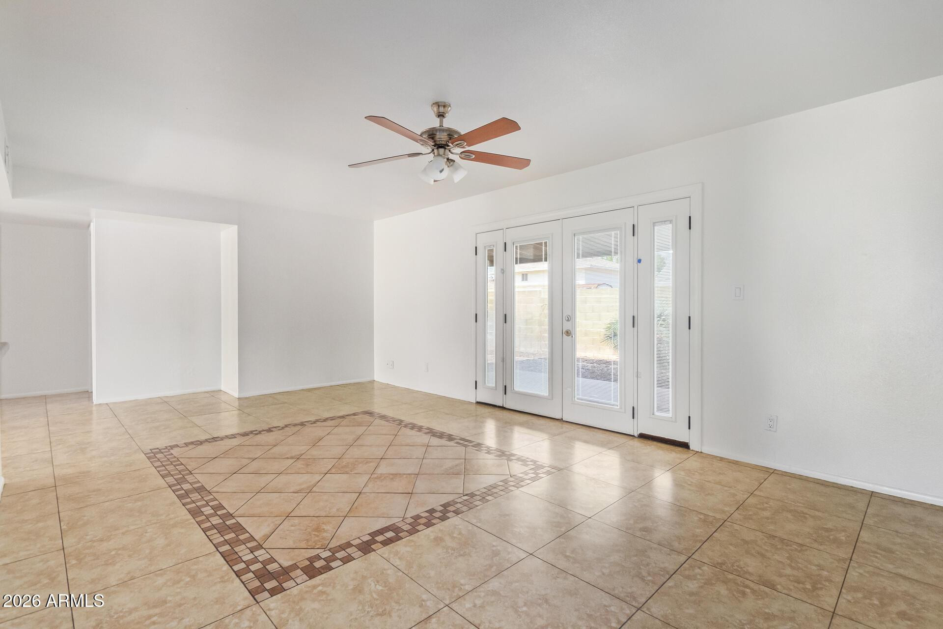 3929 South Pine Street Tempe, AZ 85282 - Photo 6 of 23 a view of a livingroom with a ceiling fan and window