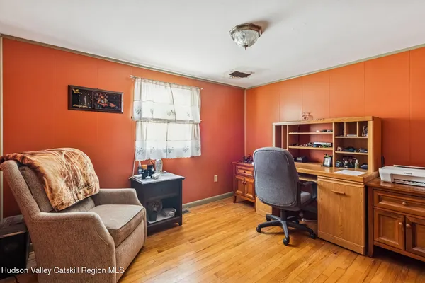 a work room with furniture and a window