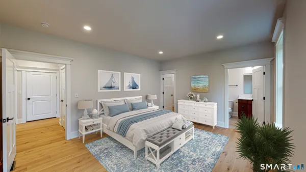 a bed room with a bed and a potted plant
