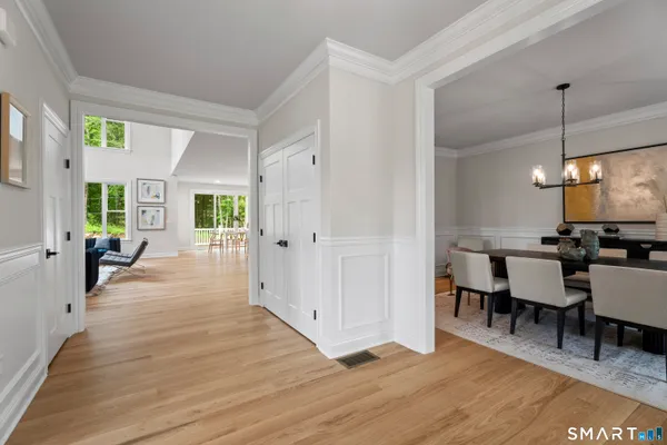 a view of a dining area with furniture window and wooden floor
