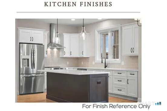 a kitchen with kitchen island a sink stainless steel appliances and cabinets