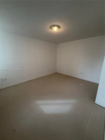 an empty room with a bench
