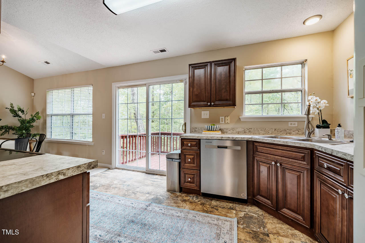 3 Little Stone Circle Durham, NC 27703 - Photo 11 of 27 a kitchen with a stove sink and cabinets