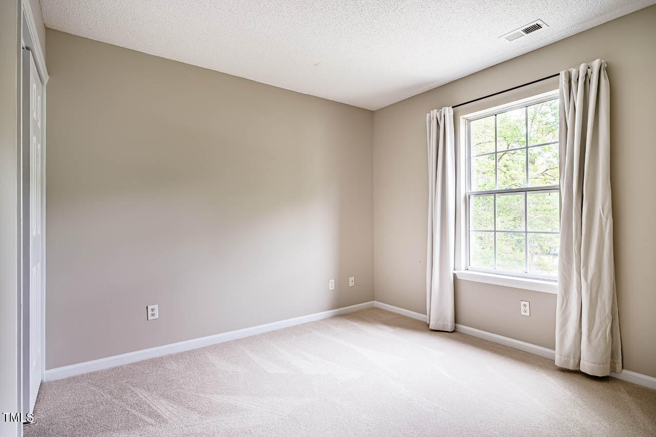 3 Little Stone Circle Durham, NC 27703 - Photo 22 of 27 a view of an empty room with a window