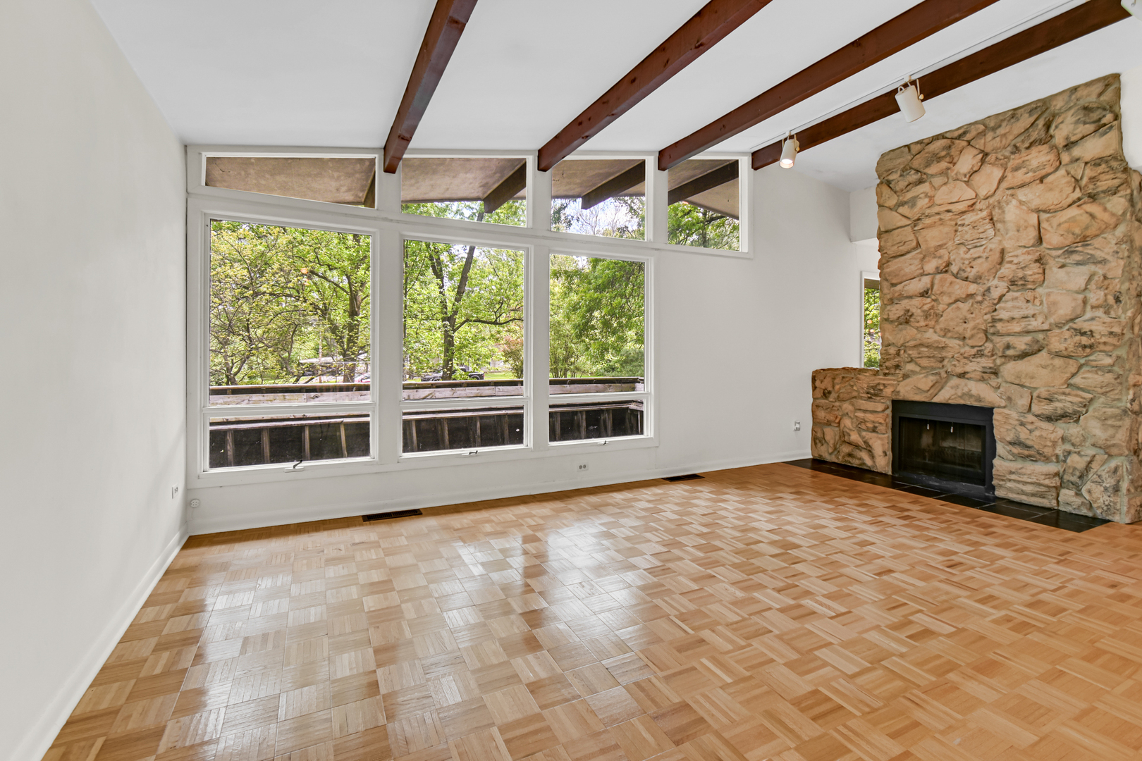 4112 Sunset Road Matteson, IL 60443 - Photo 6 of 28 a view of an empty room with a fireplace and a window