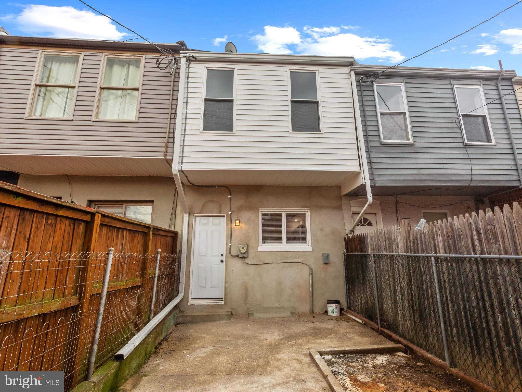 5 North Clinton Street Baltimore, MD 21224 - Photo 27 of 30 Rear view of house featuring a fenced backyard