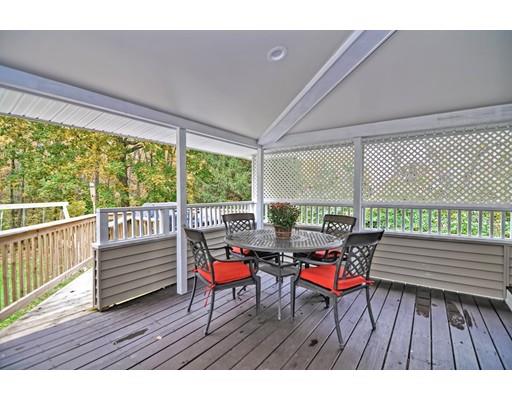 14 Tanner Road Webster, MA 01570 - Photo 22 of 28 a balcony with chairs and wooden floor