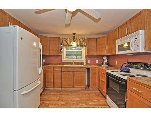 14 Tanner Road Webster, MA 01570 - Photo 10 of 28 a kitchen with kitchen island granite countertop a refrigerator stove top oven and sink