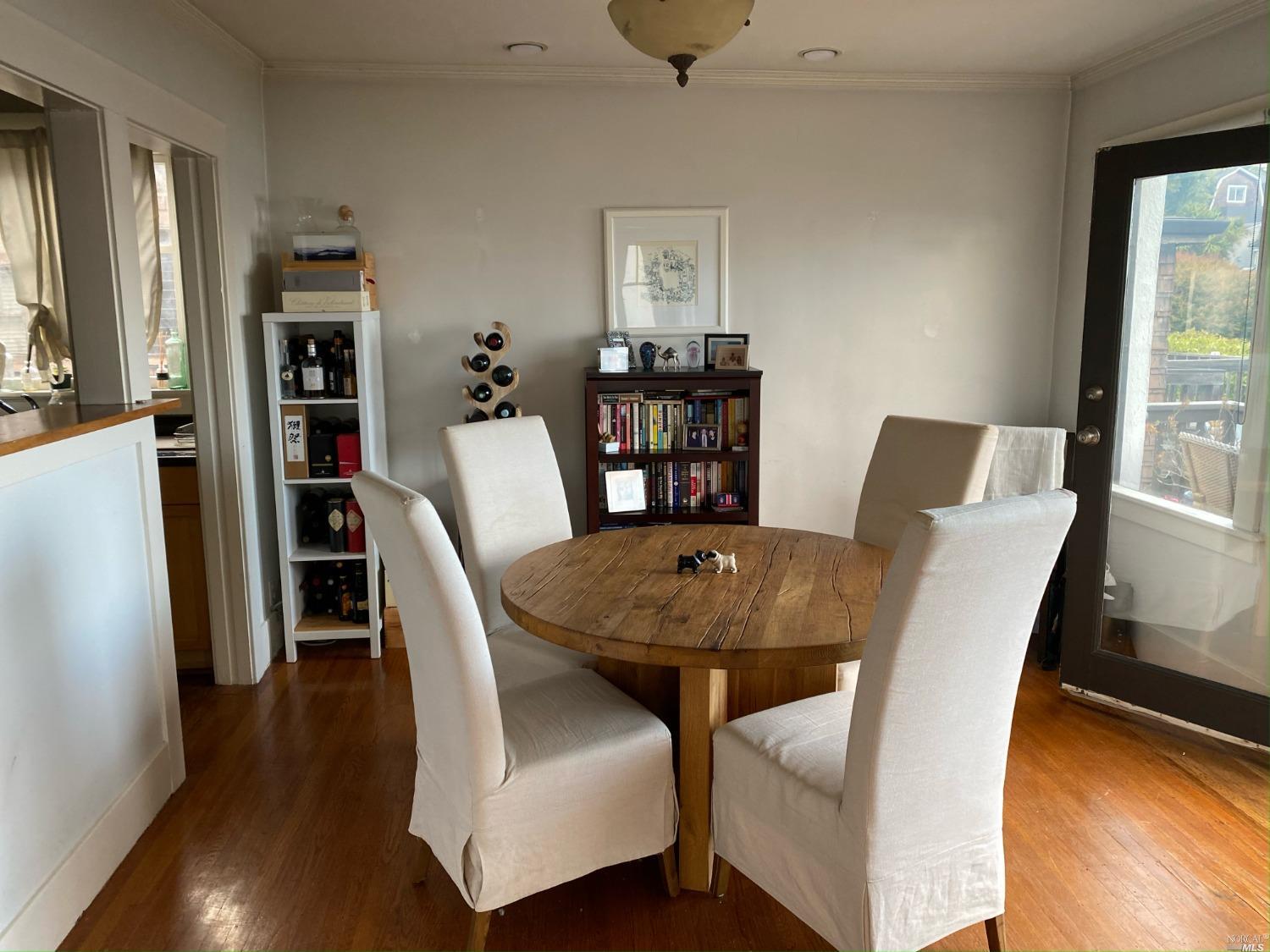 6 West Court, Unit B Sausalito, CA 94965 - Photo 2 of 9 a view of a dining room with furniture and wooden floor