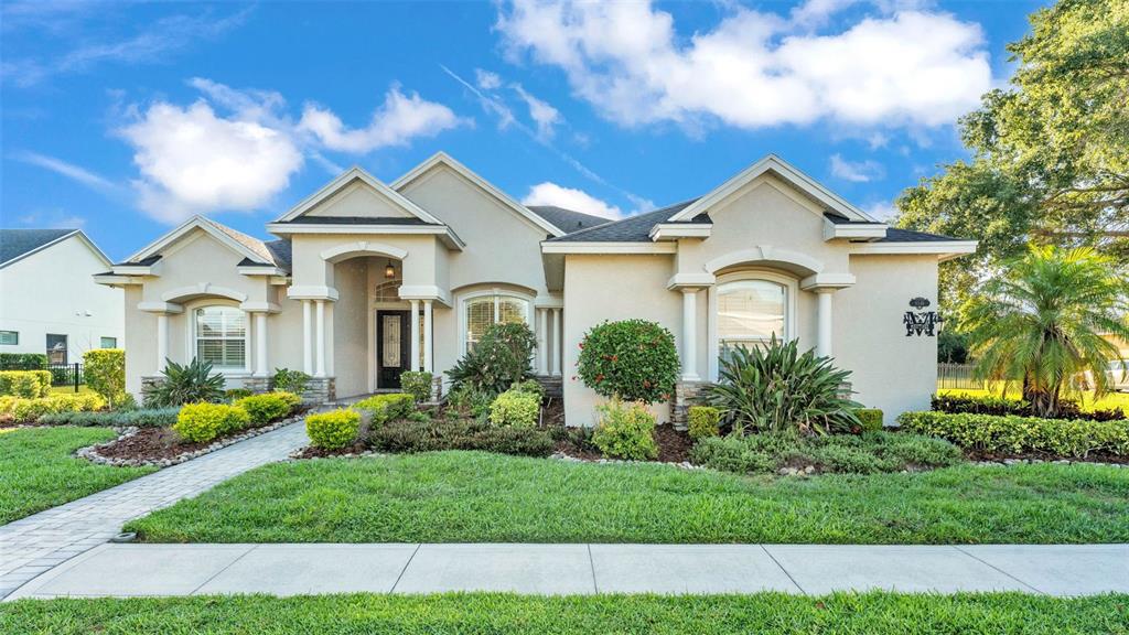 6546 Eagle View Loop Lakeland, FL 33813 - Photo 1 of 1 a front view of a house with a yard