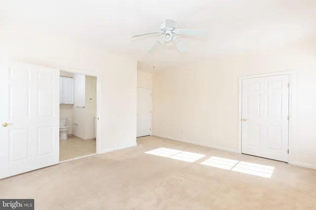 an empty room with a bathroom