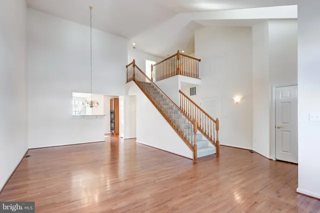 a view of an entryway with wooden floor