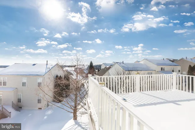 a view of a white house with a outdoor space