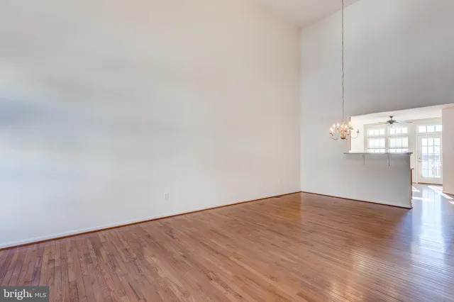 a view of a room with wooden floor