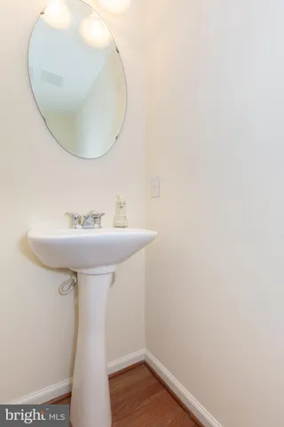 a bathroom with a sink and mirror