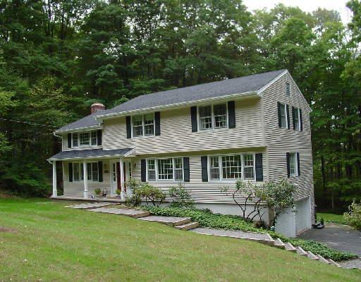 190 Mimosa Circle Ridgefield, CT 06877 - Photo 1 of 1 a front view of a house with a garden