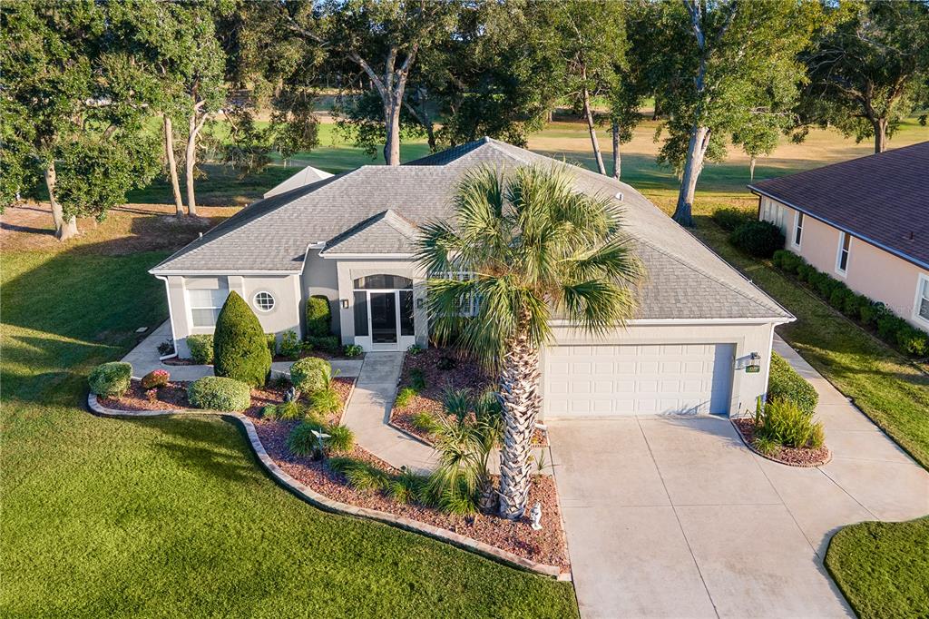 5355 Grove Manor Lady Lake, FL 32159 - Photo 1 of 1 a front view of a house with garden