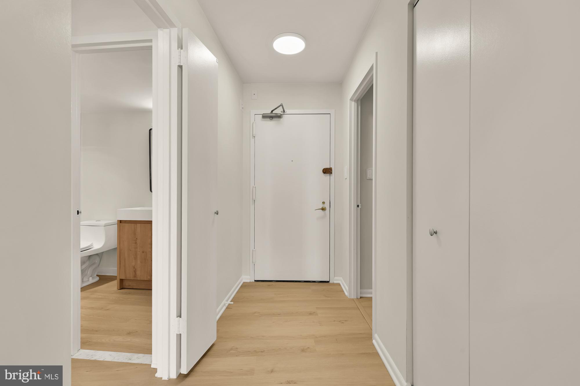 4620 North Park Avenue, Unit 1211E Chevy Chase, MD 20815 - Photo 2 of 37 a view of a bathroom from a hallway