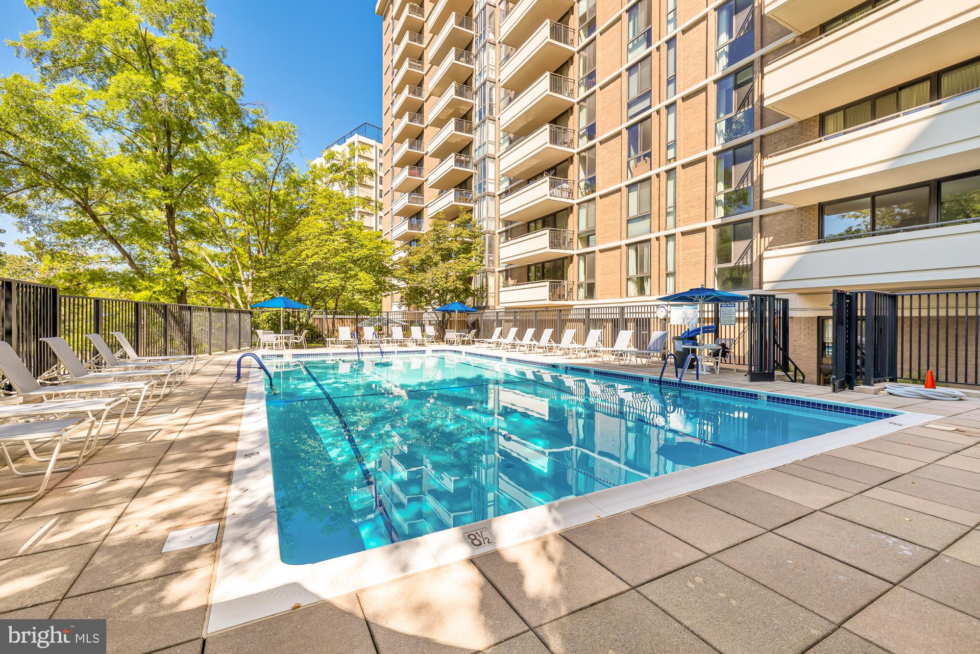 4620 North Park Avenue, Unit 1211E Chevy Chase, MD 20815 - Photo 35 of 37 a view of a swimming pool with a patio