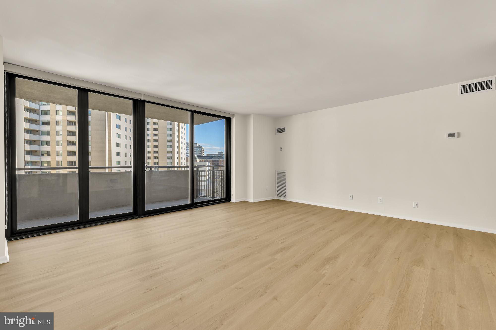 4620 North Park Avenue, Unit 1211E Chevy Chase, MD 20815 - Photo 4 of 37 a view of an empty room with a window