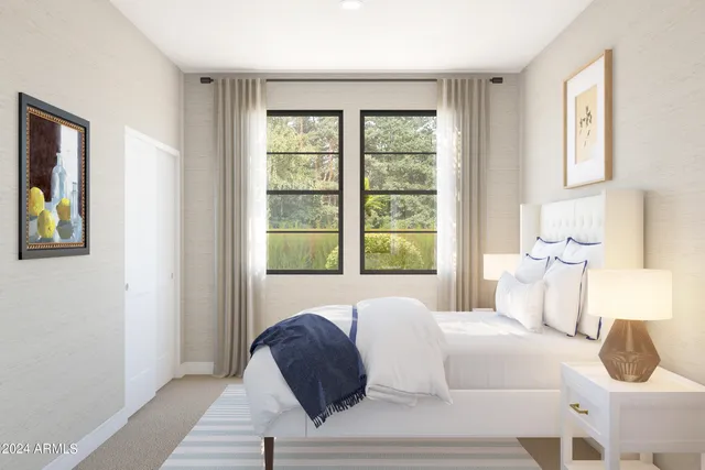 a bed room with a bed and a large window