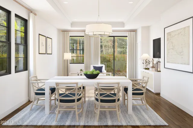 a view of a dining room with furniture large windows and wooden floor