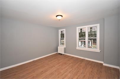 210 Chesterfield Road Pittsburgh, PA 15213 - Photo 5 of 11 an empty room with wooden floor and windows