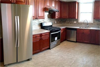 210 Chesterfield Road Pittsburgh, PA 15213 - Photo 8 of 11 a kitchen with granite countertop a refrigerator stove top oven with a sink and dishwasher