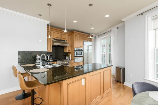 a large kitchen with granite countertop lots of counter top space
