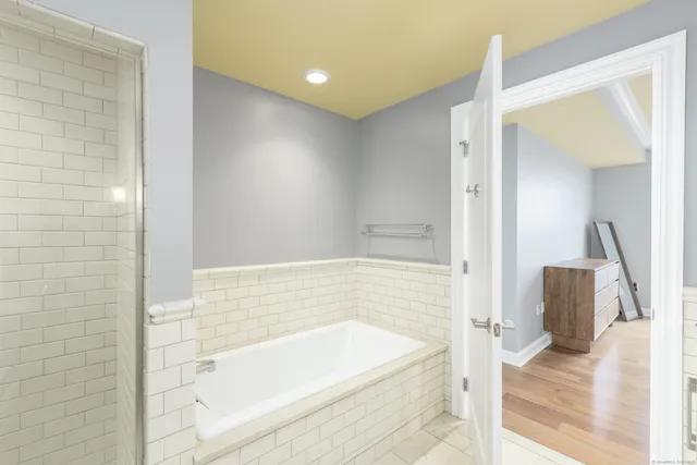 a bathroom with a bathtub and a sink