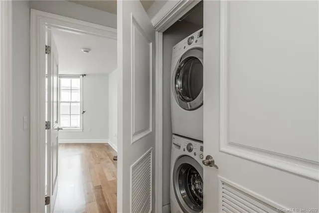 a view of a hallway with washer and dryer