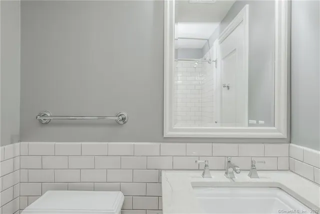 a bathroom with a sink and vanity