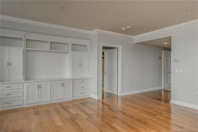 wooden floor with white walls