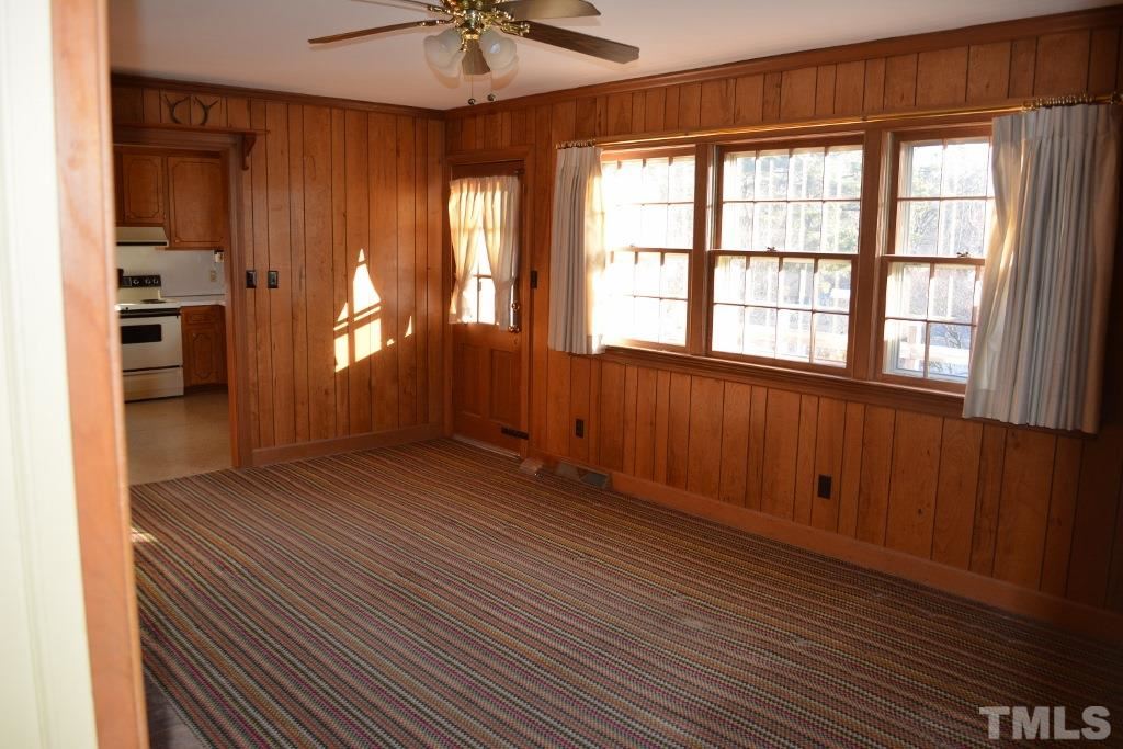 2808 Glen Burnie Drive Raleigh, NC 27607 - Photo 12 of 23 wooden floor in an empty room with a window