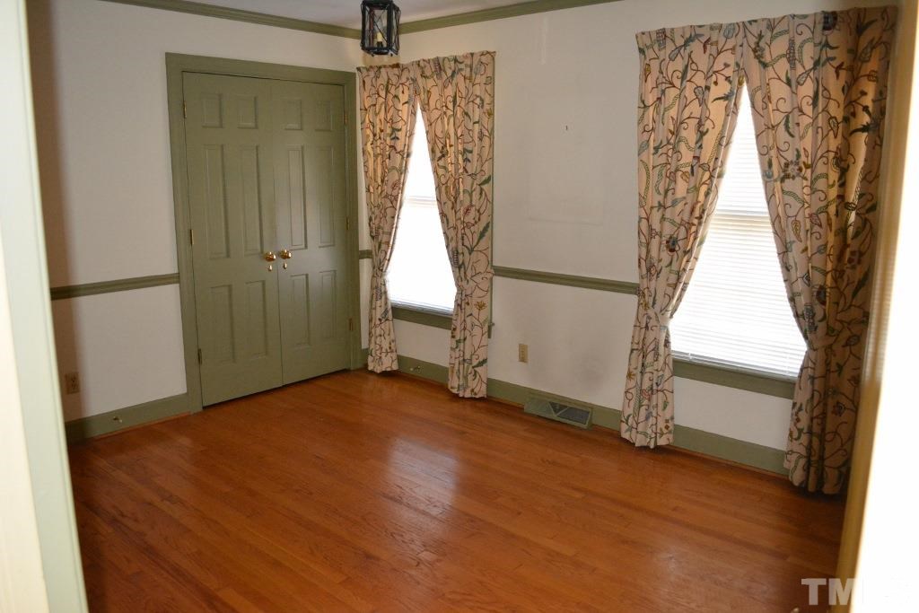 2808 Glen Burnie Drive Raleigh, NC 27607 - Photo 14 of 23 an empty room with windows and entrance