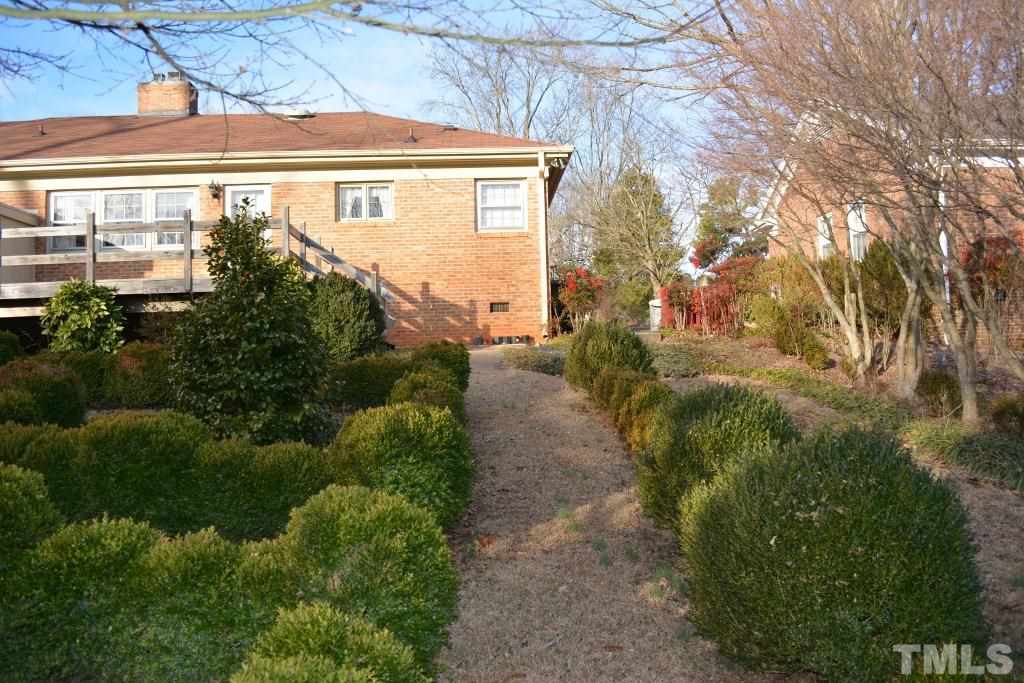 2808 Glen Burnie Drive Raleigh, NC 27607 - Photo 23 of 23 a front view of a house with garden