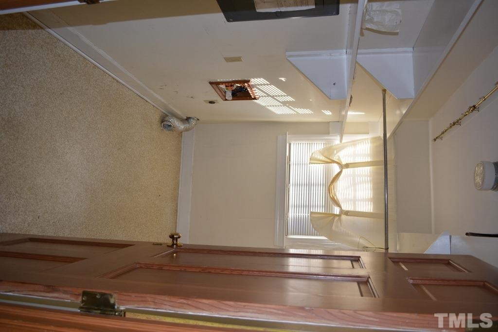 2808 Glen Burnie Drive Raleigh, NC 27607 - Photo 9 of 23 a view of entryway and hall with wooden floor